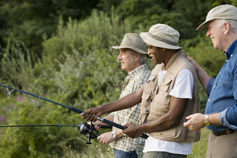 Three senior men fishing together