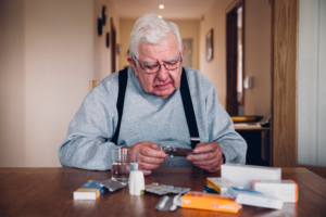 Senior man reviewing his medications