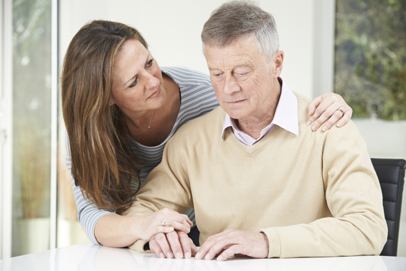 caregiver concerned about Alzheimer's man