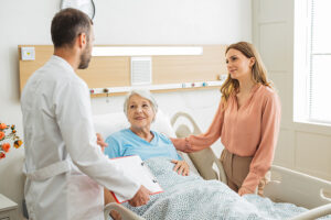 Woman talking with doctor to advocate for an older loved one during a hospital stay