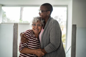Anxiety in the elderly is a significant issue. A woman hugs her aging mother as they work through her anxiety together.